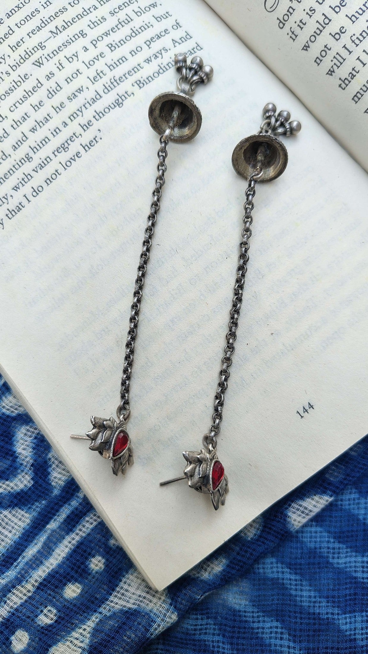 Side view of Kumkum Earrings in pure silver with handcrafted detailing