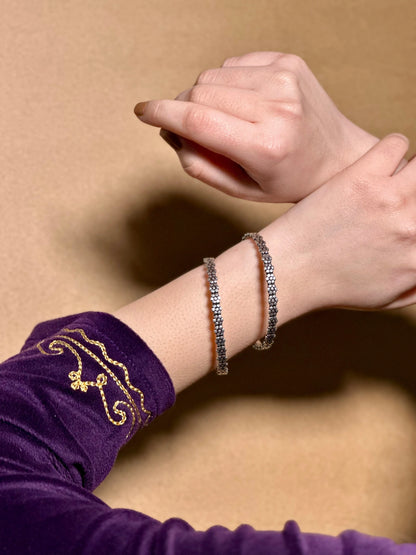 Side view of Kusum Bangles in pure silver with handcrafted detailing