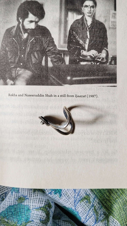Side view of Malini Vanki Ring in pure silver with handcrafted detailing