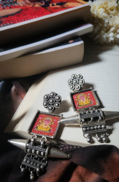Side view of Mangalmurti Earrings in pure silver with handcrafted detailing