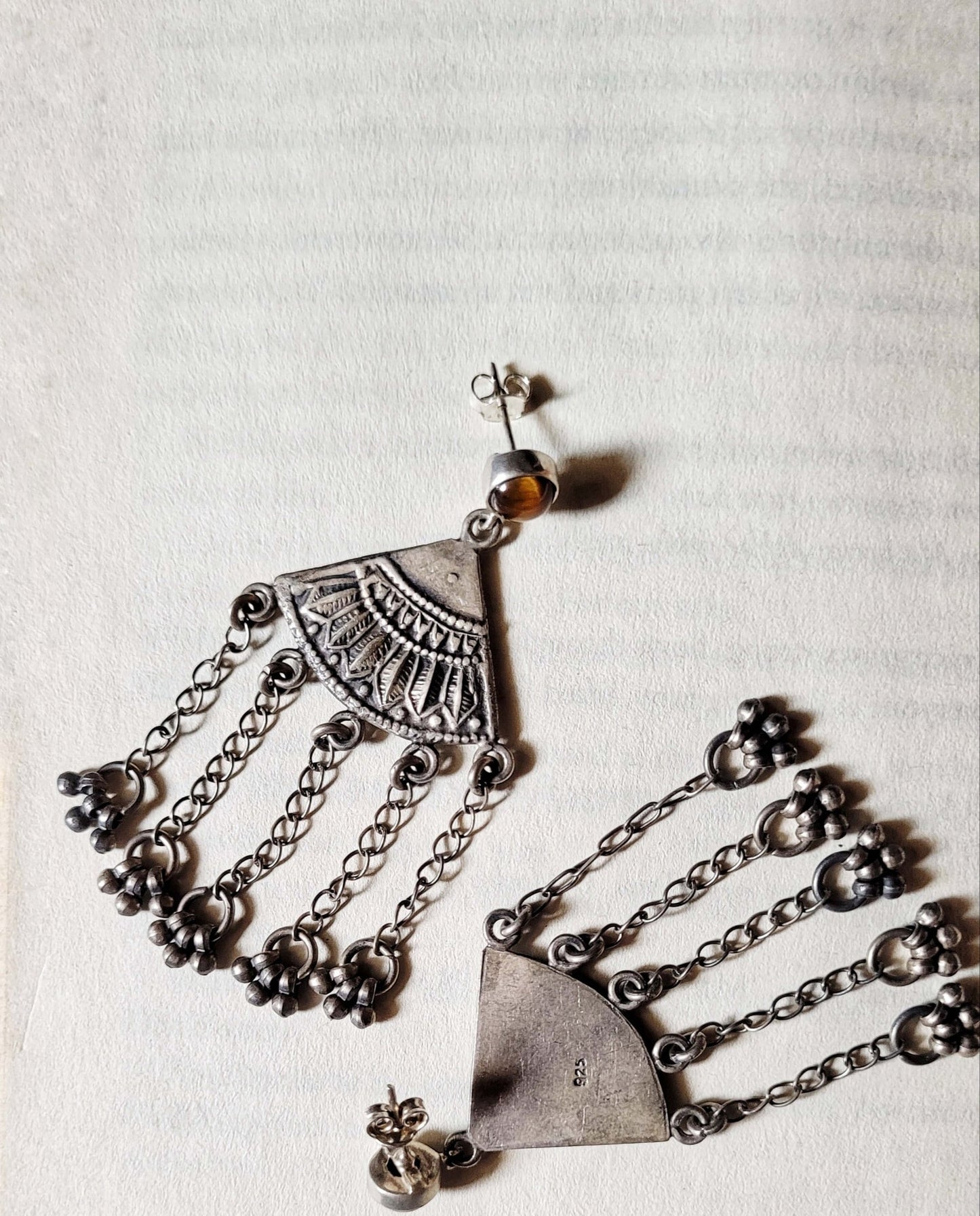 Side view of Matargashti Earrings in pure silver with handcrafted detailing