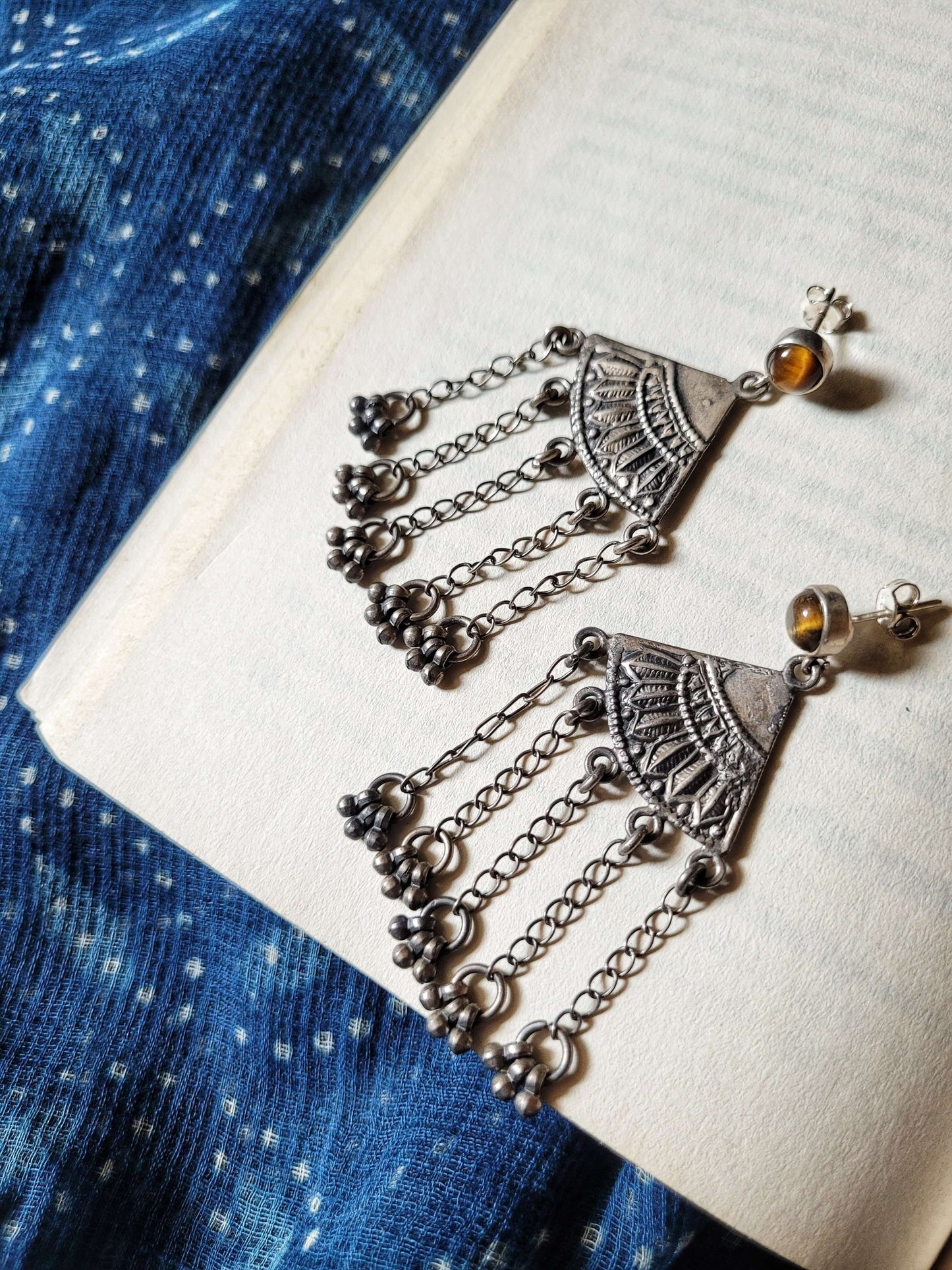 Side view of Matargashti Earrings in pure silver with handcrafted detailing
