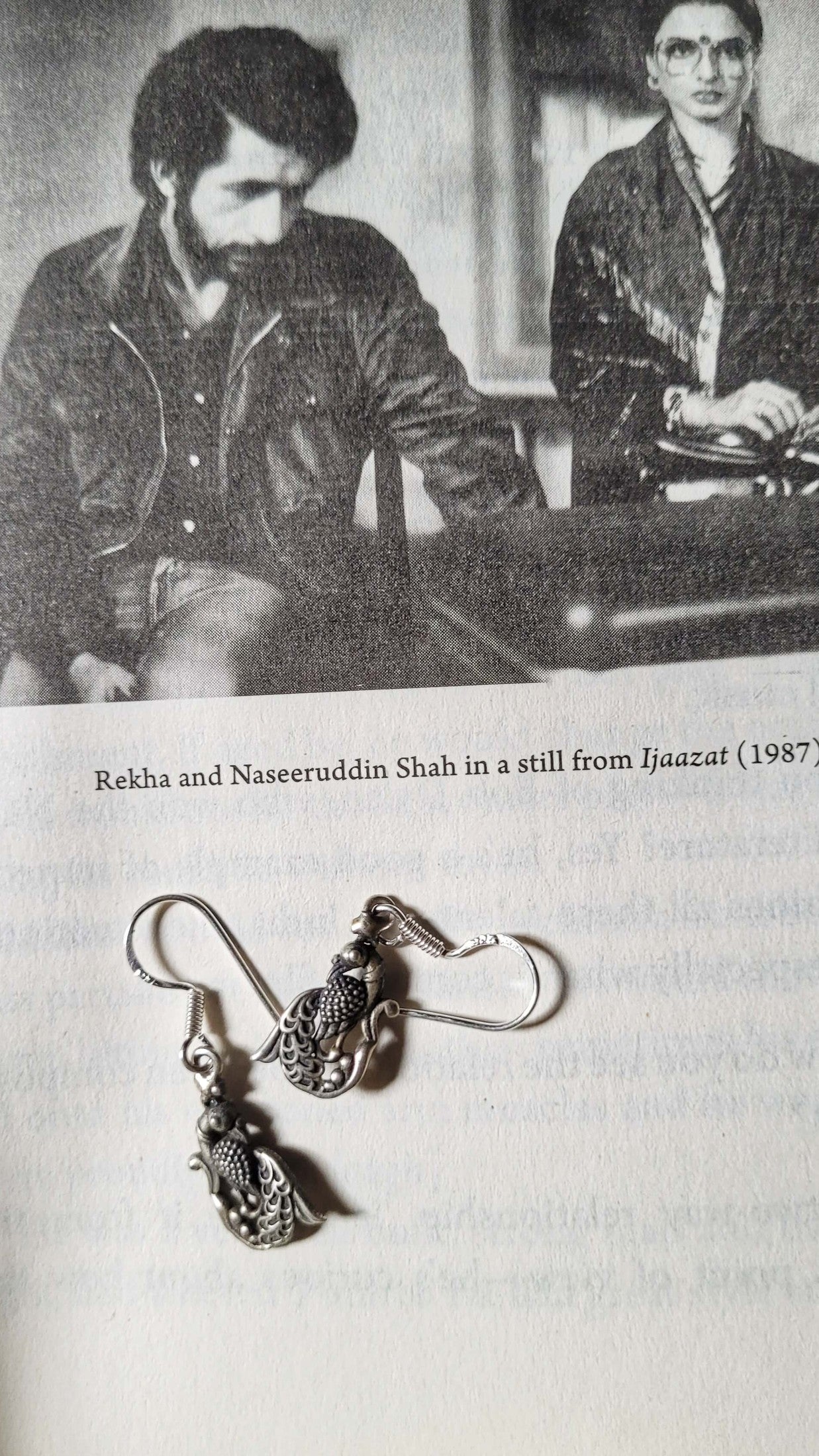 Side view of Mayil Earrings in pure silver with handcrafted detailing