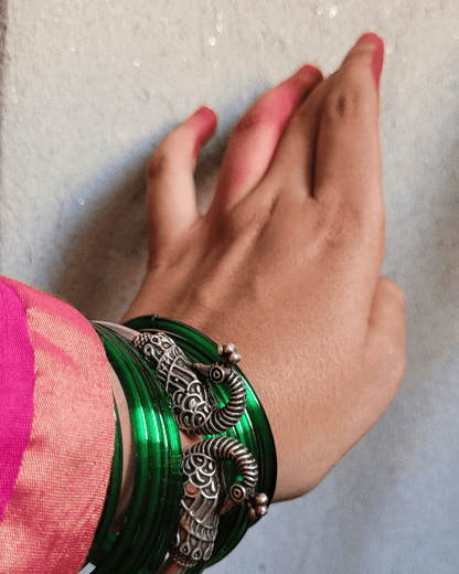 Side view of Mayurmukhi Kada in pure silver with handcrafted detailing