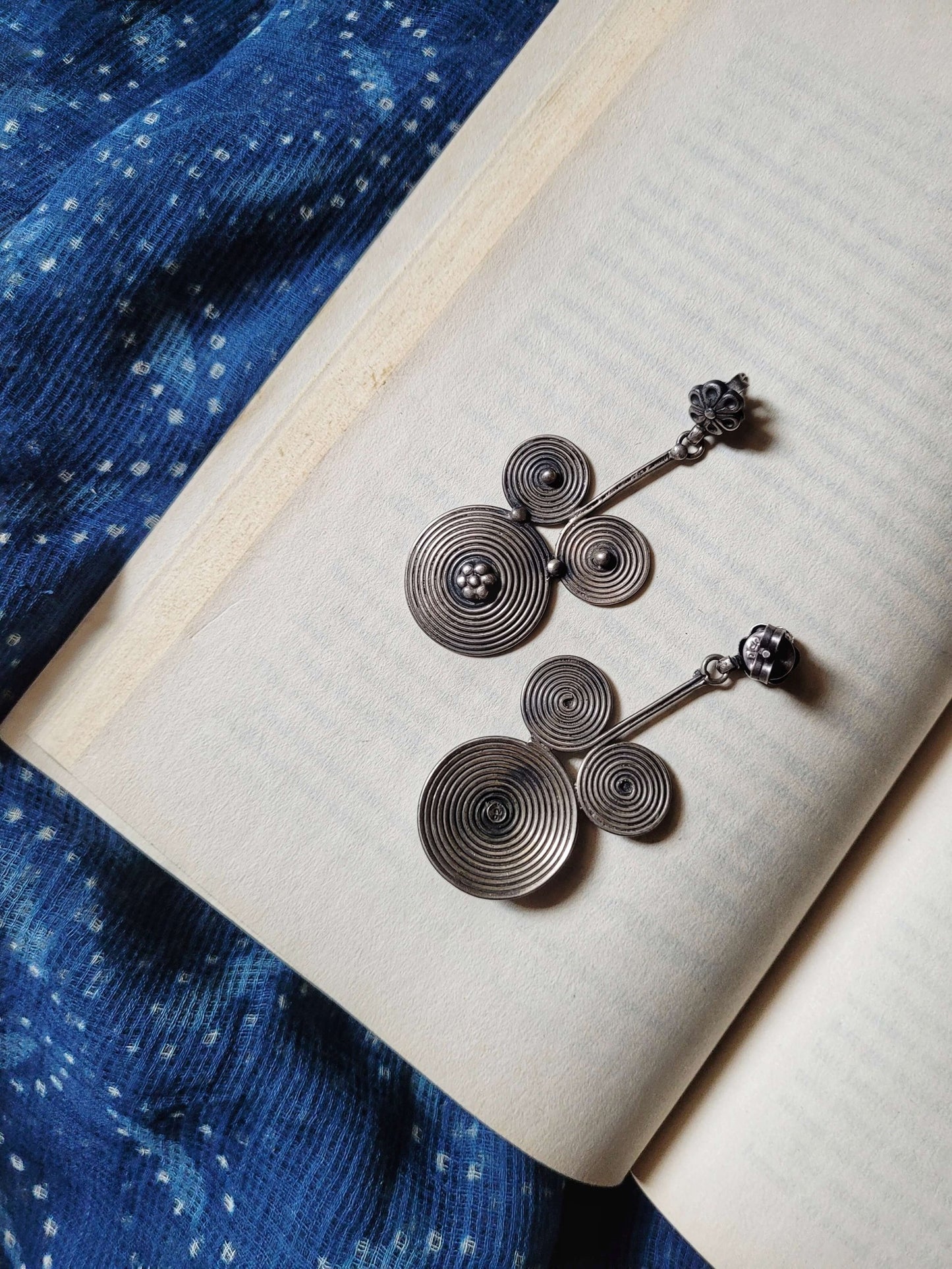 Side view of Mickey Earrings in pure silver with handcrafted detailing