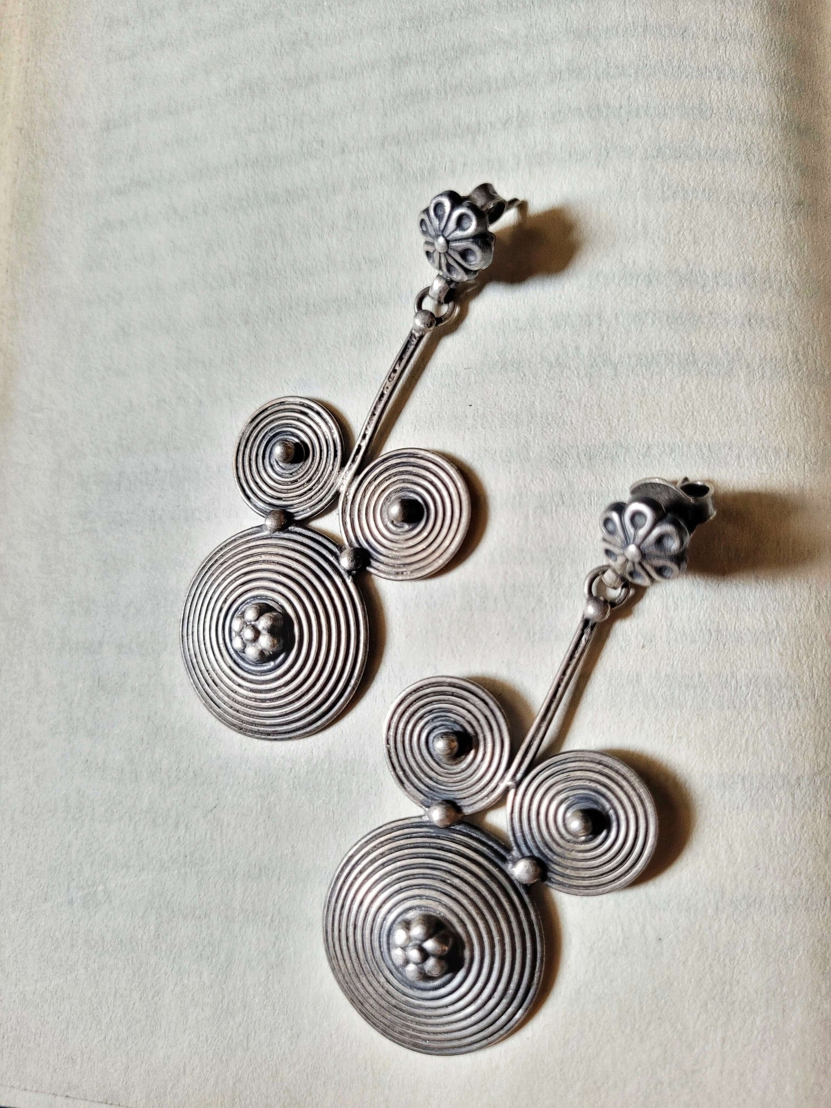 Side view of Mickey Earrings in pure silver with handcrafted detailing