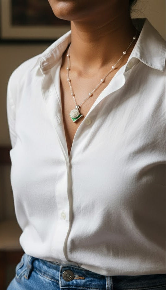 Side view of Motiya Pendant in pure silver with handcrafted detailing