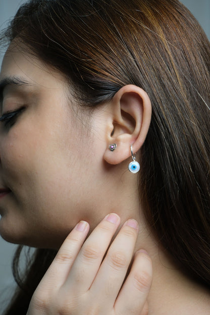 Side view of Nazar Na Lage Hoops in pure silver with handcrafted detailing
