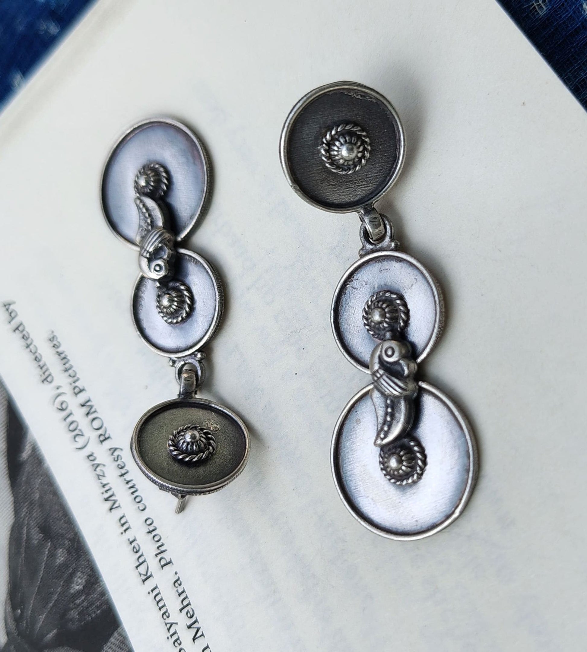 Side view of O Re Chiraiyya Earrings in pure silver with handcrafted detailing