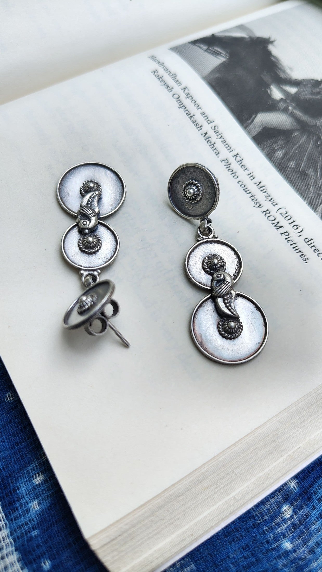 Side view of O Re Chiraiyya Earrings in pure silver with handcrafted detailing