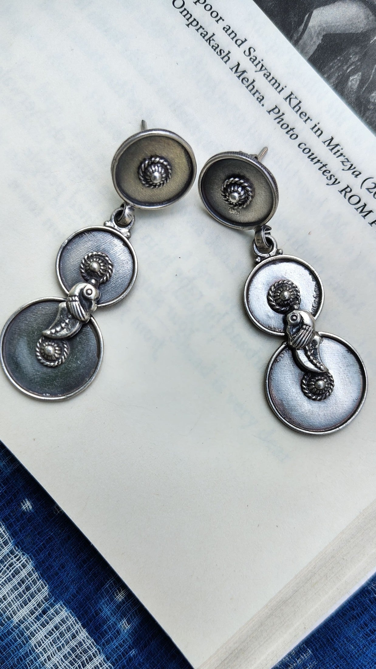 Side view of O Re Chiraiyya Earrings in pure silver with handcrafted detailing