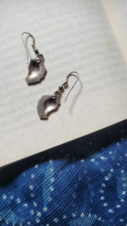 Side view of Paakhi Earrings in pure silver with handcrafted detailing
