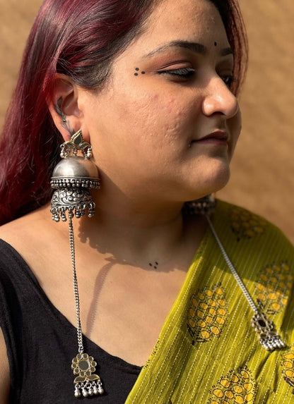 Side view of Parushni Jhumka in pure silver with handcrafted detailing