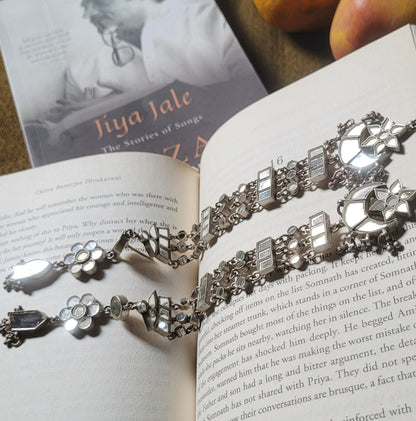 Side view of Parvaani Earrings in pure silver with handcrafted detailing