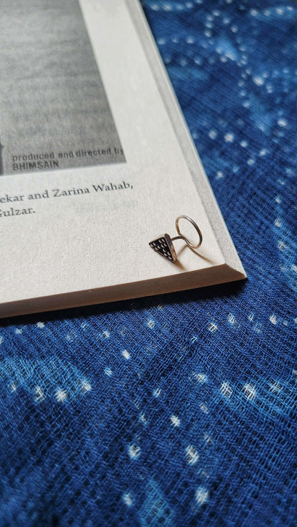 Side view of Patang Nose-Pin in pure silver with handcrafted detailing