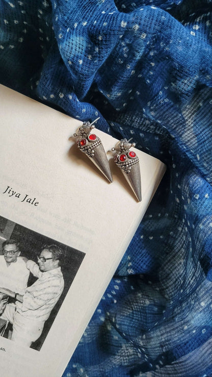 Side view of Poppy Earrings in pure silver with handcrafted detailing