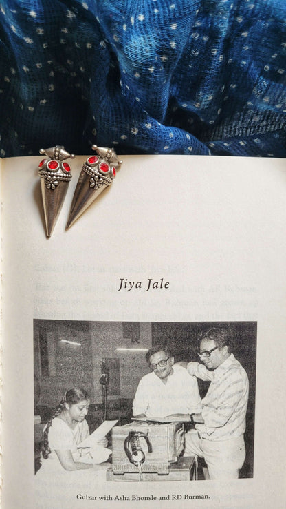 Side view of Poppy Earrings in pure silver with handcrafted detailing