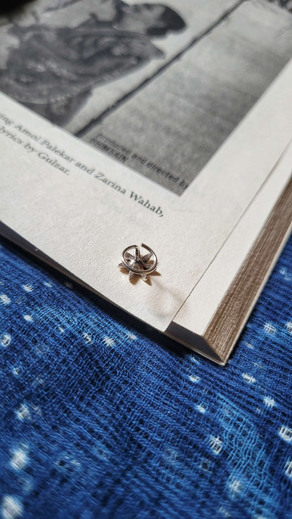 Side view of Prachi Nose-Pin in pure silver with handcrafted detailing