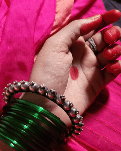 Side view of Priyadarsini Kada in pure silver with handcrafted detailing