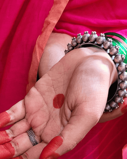 Side view of Priyadarsini Kada in pure silver with handcrafted detailing