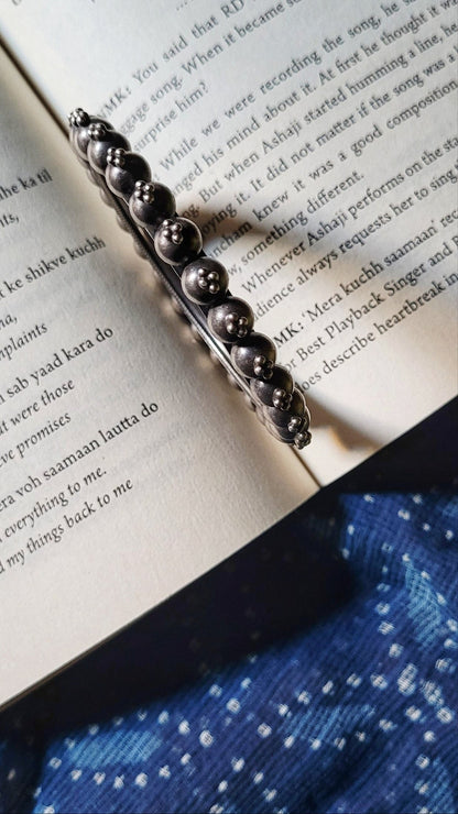 Side view of Priyadarsini Kada in pure silver with handcrafted detailing