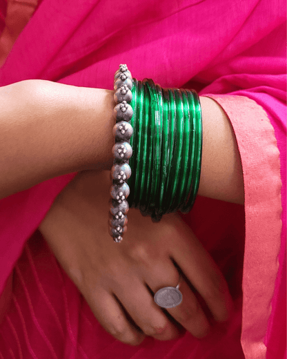 Side view of Priyadarsini Kada in pure silver with handcrafted detailing