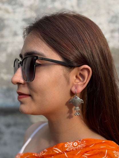 Side view of Rayini Earrings in pure silver with handcrafted detailing