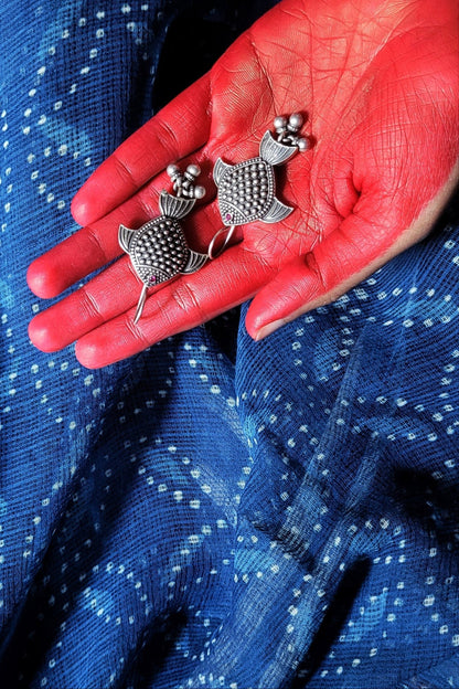 Side view of Rayini Earrings in pure silver with handcrafted detailing