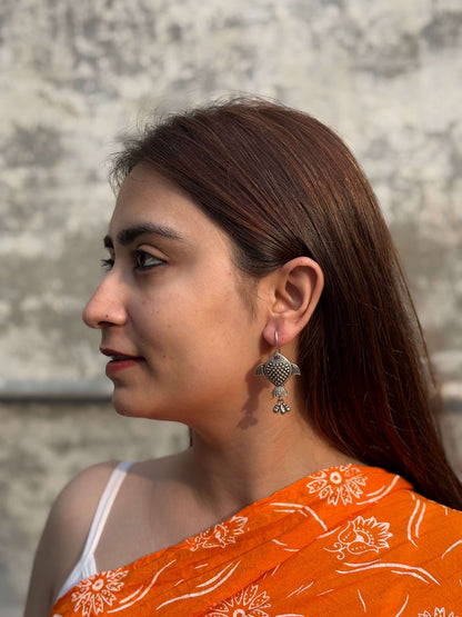 Side view of Rayini Earrings in pure silver with handcrafted detailing