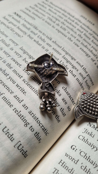 Side view of Rayini Earrings in pure silver with handcrafted detailing