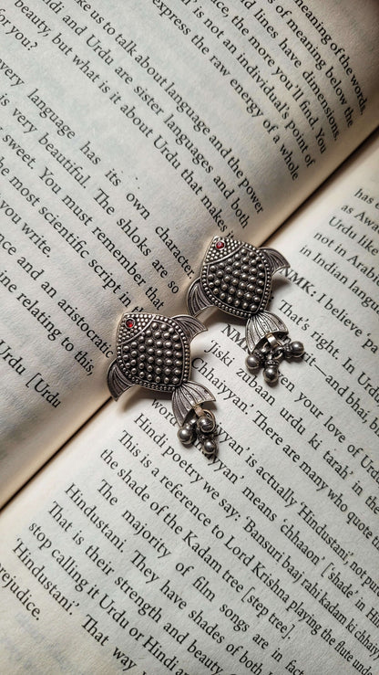 Side view of Rayini Earrings in pure silver with handcrafted detailing