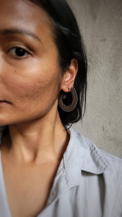 Side view of Roop Earrings in pure silver with handcrafted detailing