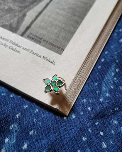 Side view of Saarang Nose-Pin in pure silver with handcrafted detailing