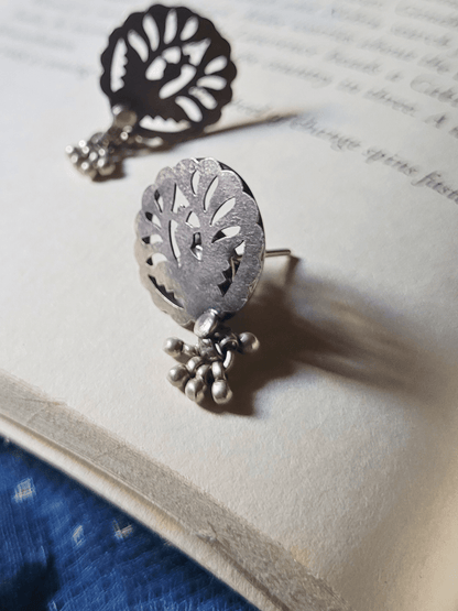 Side view of Saavani Studs in pure silver with handcrafted detailing