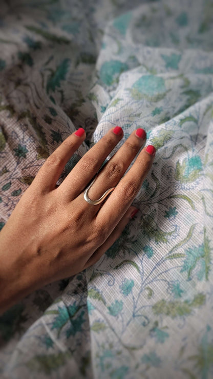 Side view of Sadabahaar Vanki Ring in pure silver with handcrafted detailing
