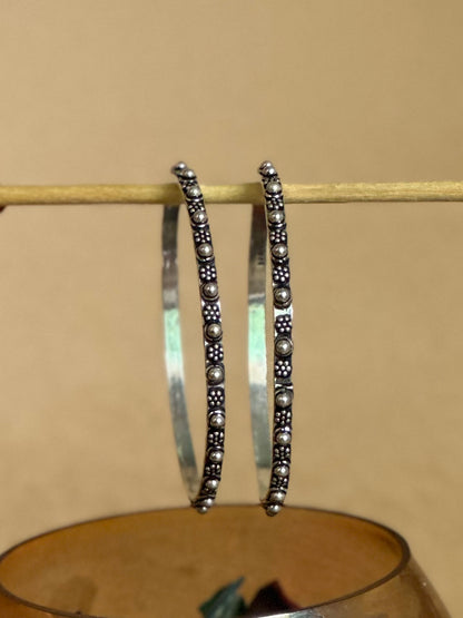Side view of Sajja Bangles in pure silver with handcrafted detailing