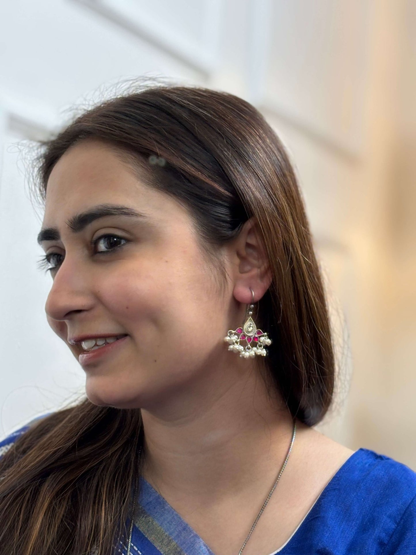 Side view of Sania Earrings in pure silver with handcrafted detailing