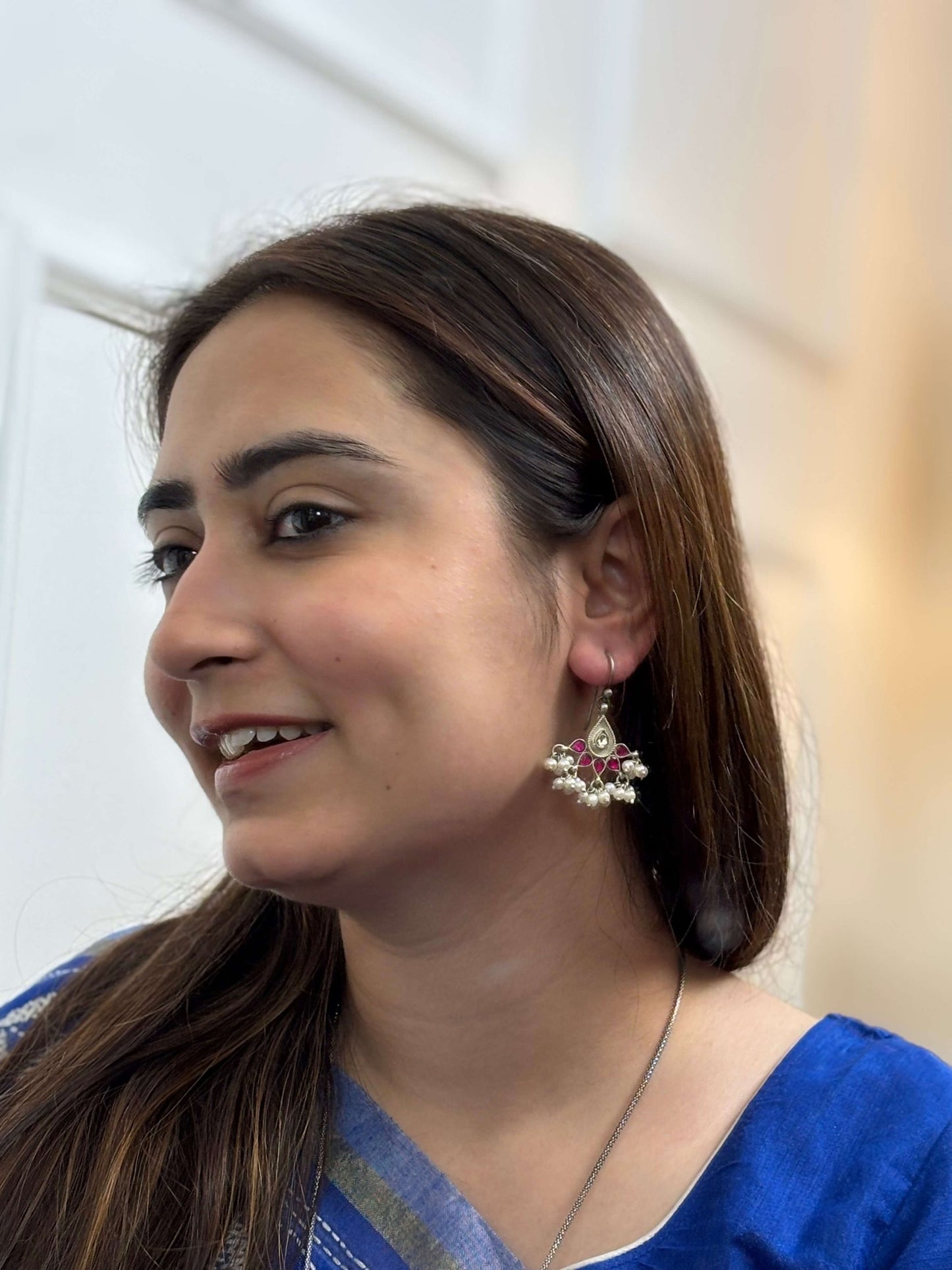 Side view of Sania Earrings in pure silver with handcrafted detailing