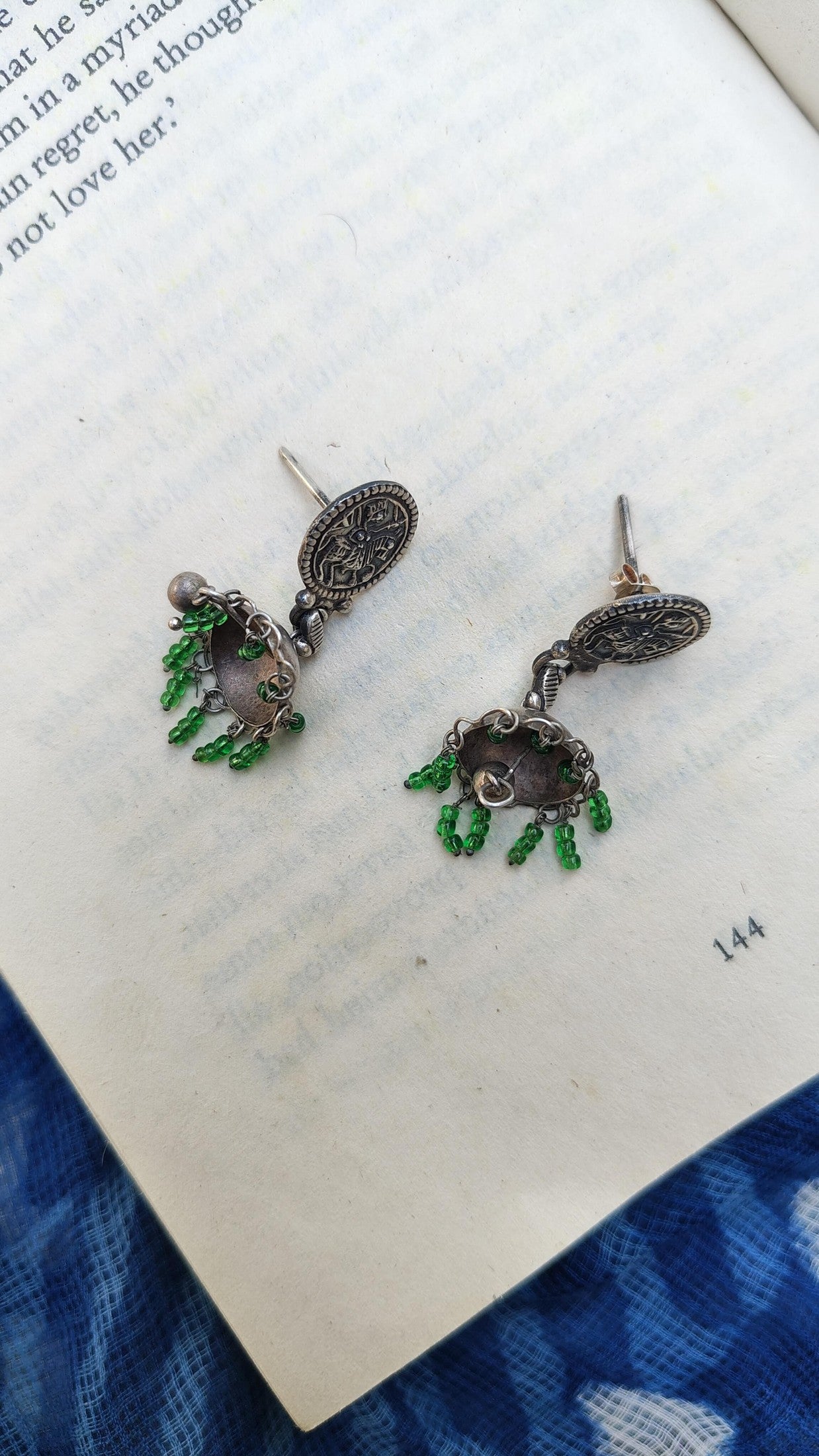 Sadabahaar Jewelry Authentic Vintage Silver Jhumka with Deity Embossed Studs, Green Beads and Central Ghungroo for Women