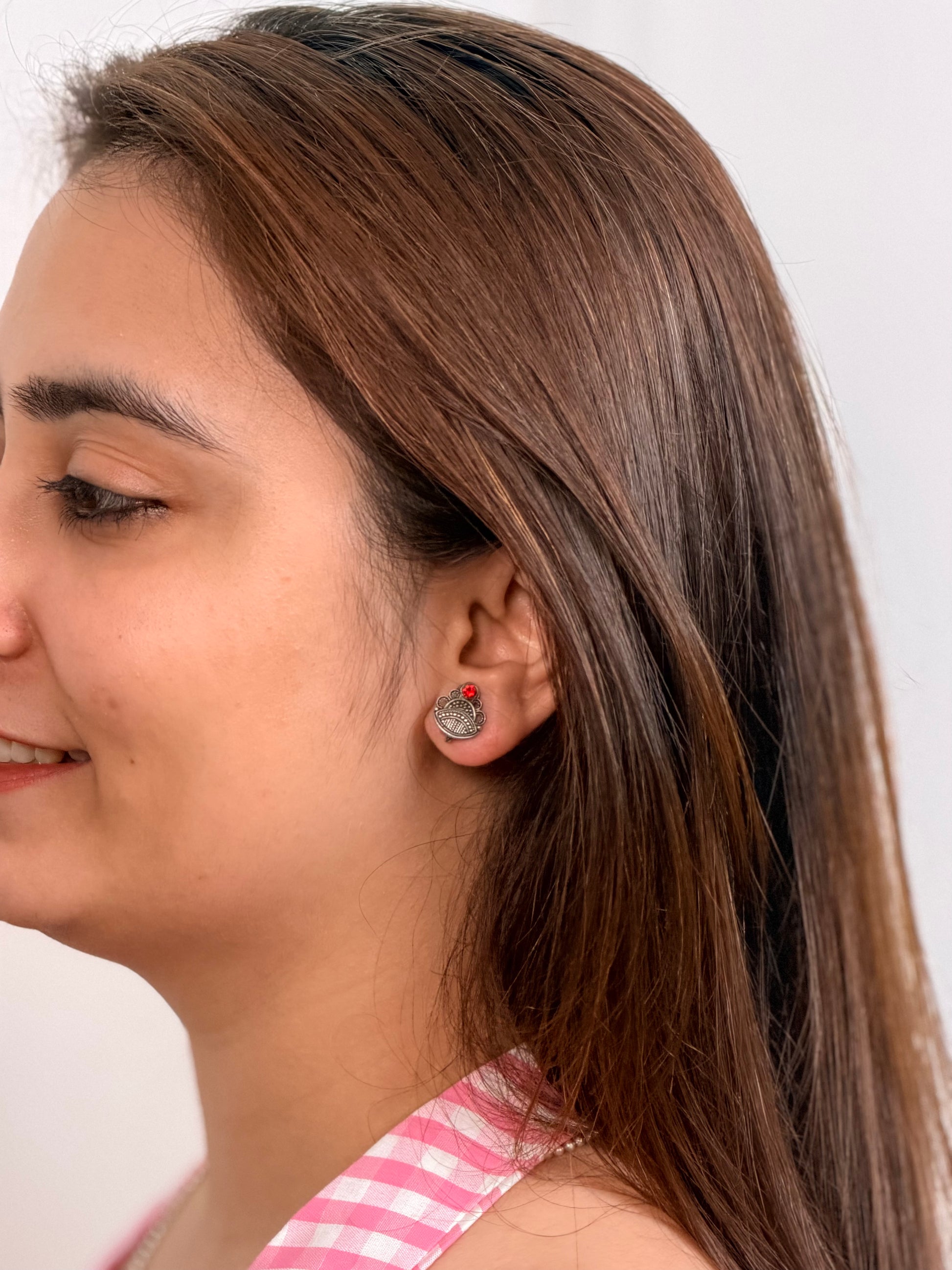 Minimalist silver studs worn