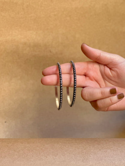 Side view of Shobha Bangles in pure silver with handcrafted detailing