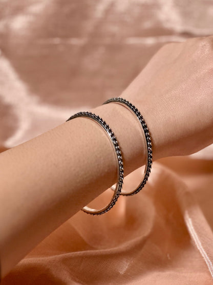 Side view of Shobha Bangles in pure silver with handcrafted detailing