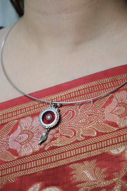 Side view of Sindoori Hasli Necklace in pure silver with handcrafted detailing