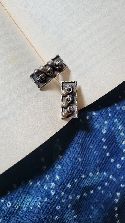 Side view of Surmai Studs in pure silver with handcrafted detailing