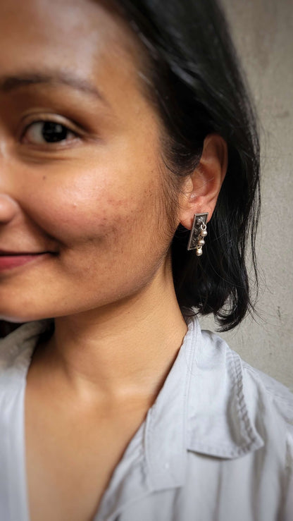Side view of Surmai Studs in pure silver with handcrafted detailing