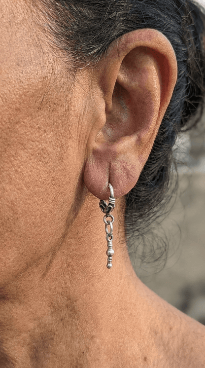 Side view of Swachhand Vintage Hoops in pure silver with vintage detailing