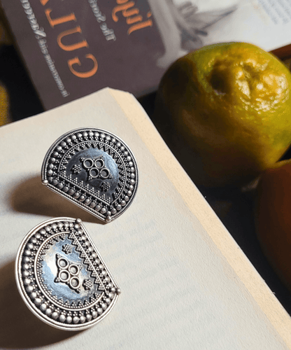 Side view of Tejas Earrings in pure silver with handcrafted detailing