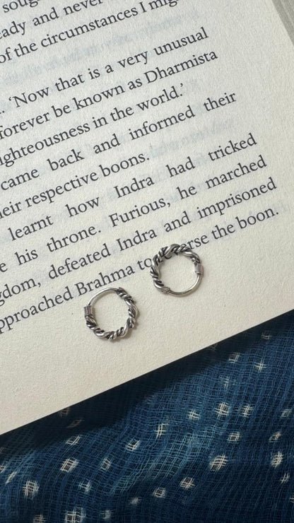 Side view of Twisted Sisters Hoops in pure silver with handcrafted detailing