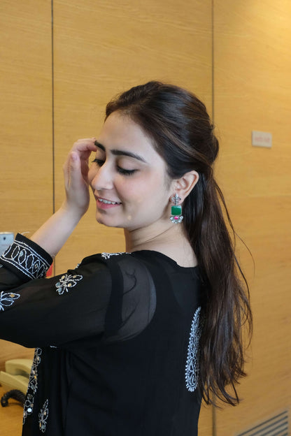 Side view of Vasant Earrings in pure silver with handcrafted detailing
