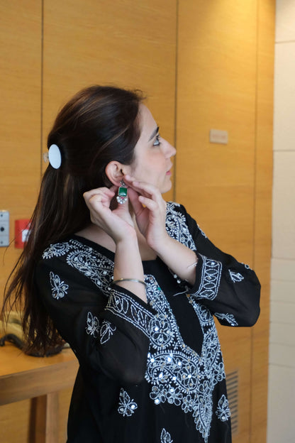 Side view of Vasant Earrings in pure silver with handcrafted detailing